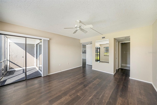 unfurnished room featuring ceiling fan, a textured ceiling, and dark hardwood / wood-style flooring