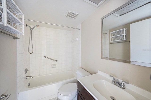 full bathroom with vanity, toilet, and tiled shower / bath combo