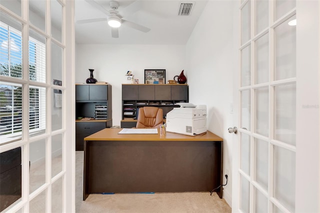 carpeted office space with ceiling fan and french doors