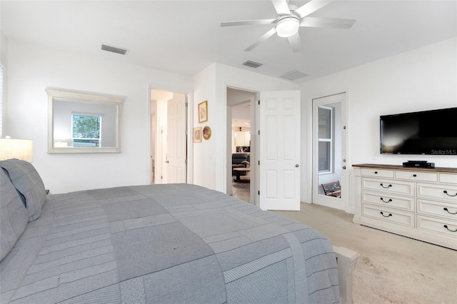 bedroom featuring ceiling fan and light carpet