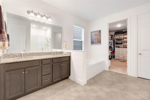 bathroom featuring separate shower and tub and vanity