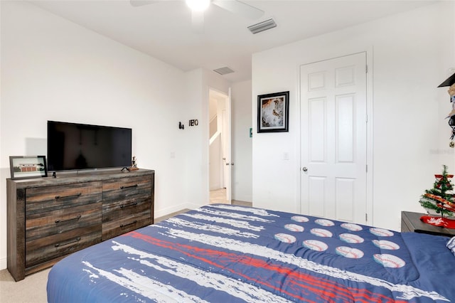 bedroom featuring ceiling fan and a closet