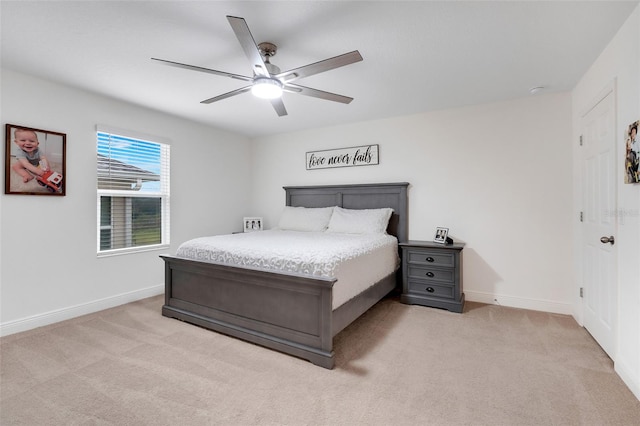 bedroom featuring ceiling fan and light carpet