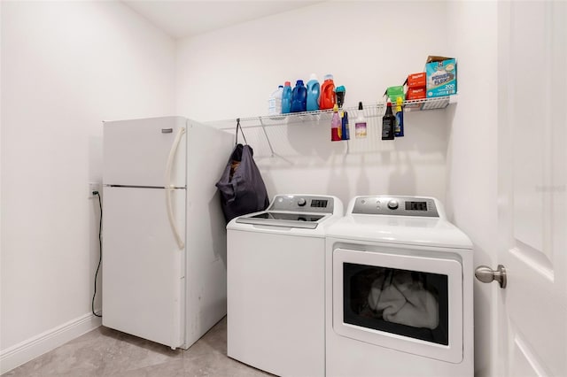 washroom with separate washer and dryer