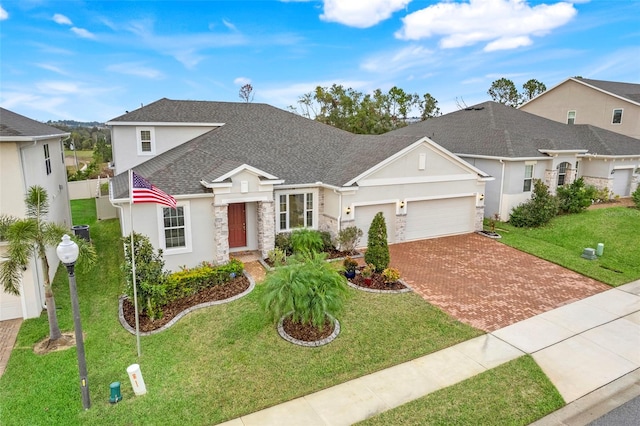 view of front of house featuring a front lawn and a garage