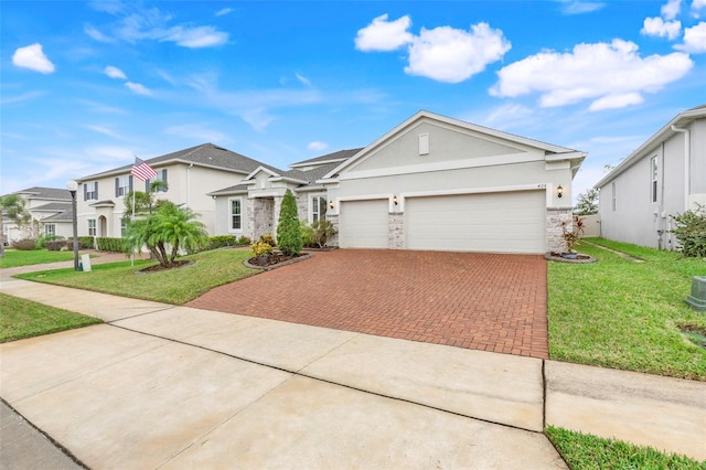 view of front of property with a garage and a front yard