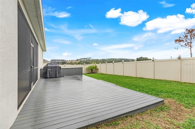 deck featuring a lawn