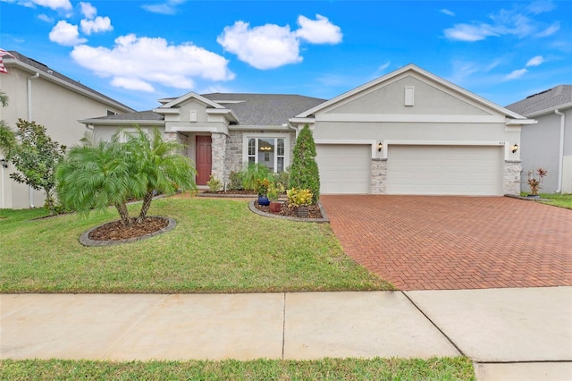 ranch-style house featuring a front lawn and a garage