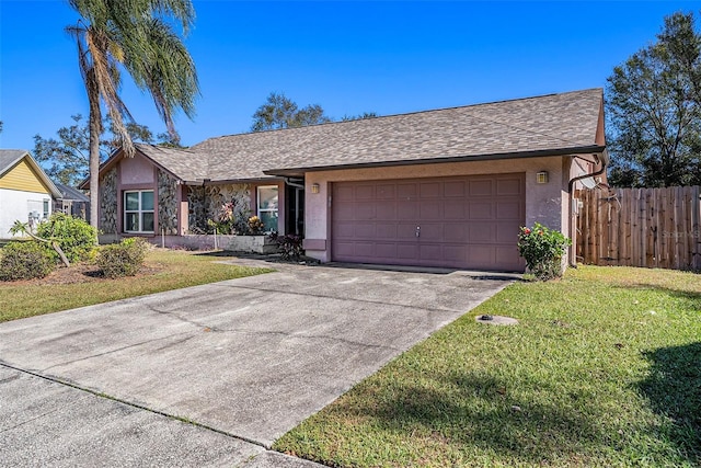 ranch-style house featuring a garage and a front lawn