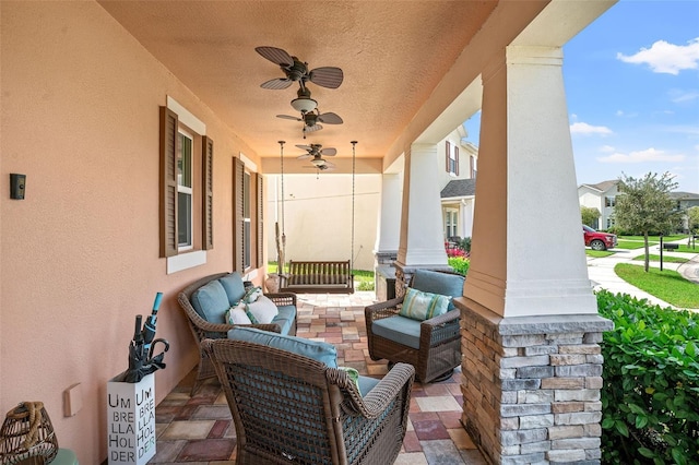 view of patio / terrace featuring ceiling fan and a porch