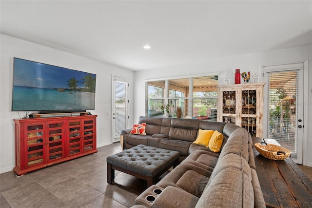 living room with tile patterned flooring