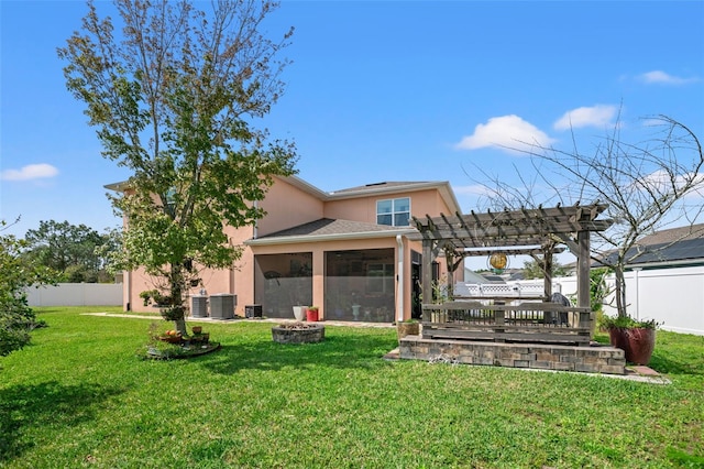 view of yard with a sunroom, a pergola, and central AC