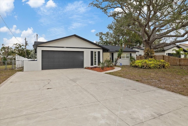 ranch-style house featuring a garage