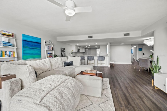 living room featuring hardwood / wood-style flooring and ceiling fan