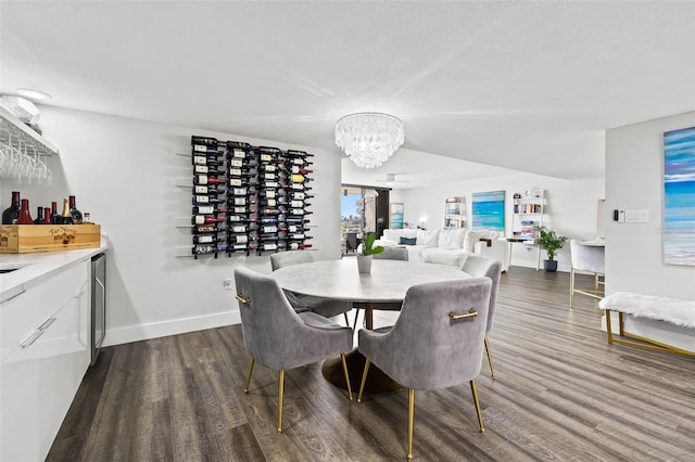 dining space with a chandelier and dark hardwood / wood-style floors