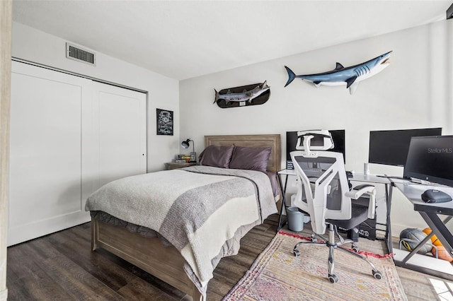 bedroom featuring hardwood / wood-style flooring and a closet