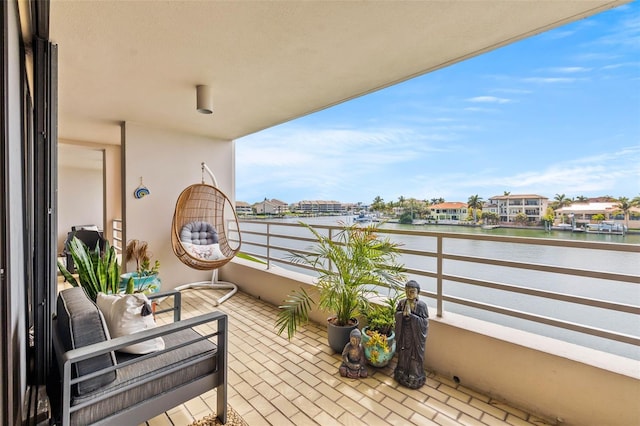 balcony featuring a water view