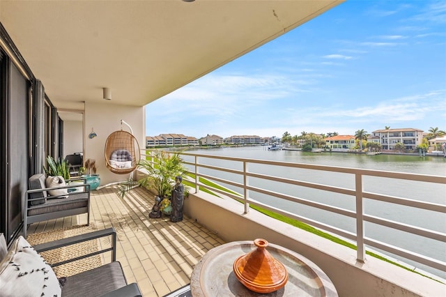 balcony featuring a water view