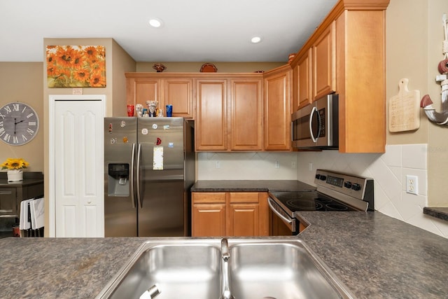 kitchen with backsplash, sink, and stainless steel appliances