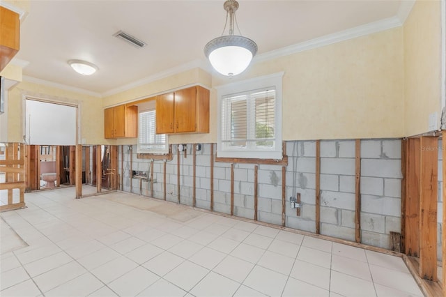 kitchen featuring light tile patterned flooring and ornamental molding