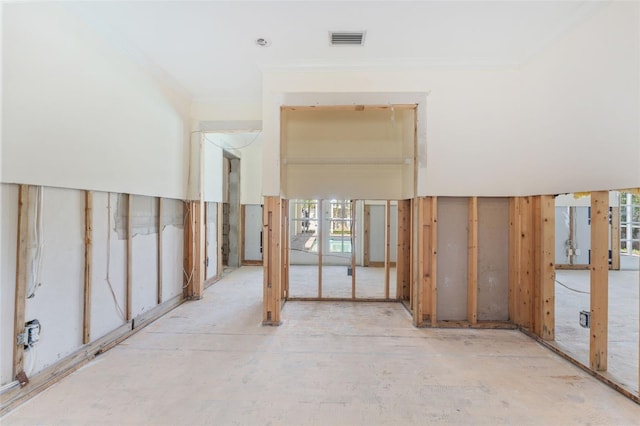 interior space with crown molding