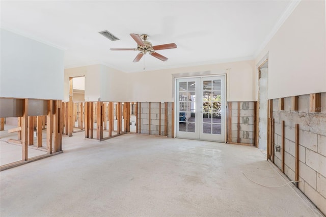 carpeted spare room with crown molding, ceiling fan, and french doors