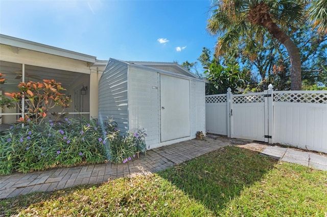 view of outbuilding featuring a lawn