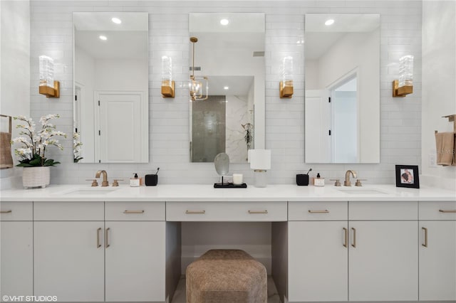 bathroom featuring vanity and decorative backsplash