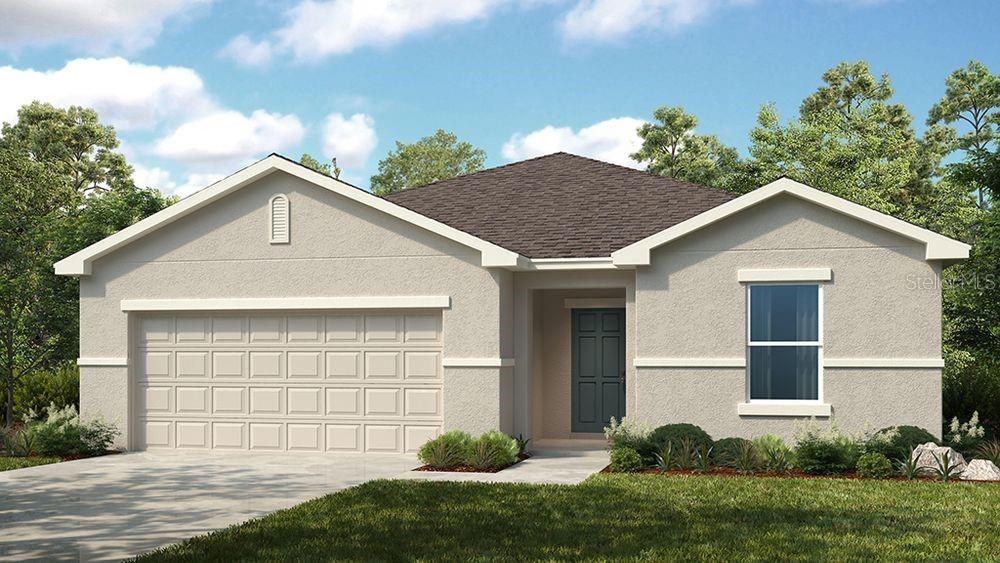 view of front of home with a garage and a front yard