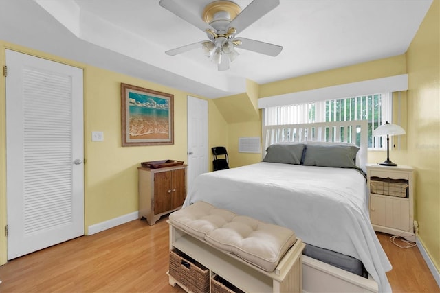 bedroom with light wood-type flooring and ceiling fan