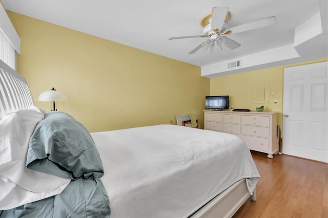 bedroom featuring ceiling fan and wood-type flooring