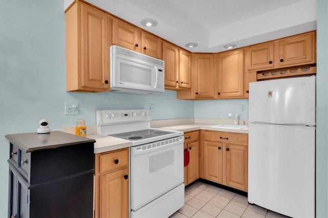 kitchen with sink, light tile patterned flooring, and white appliances