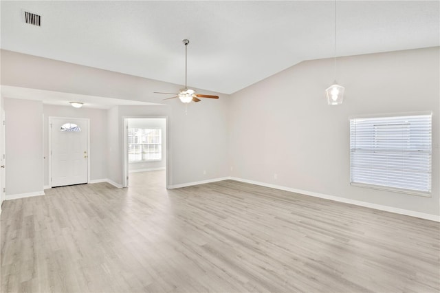 unfurnished living room featuring light hardwood / wood-style flooring, vaulted ceiling, and ceiling fan