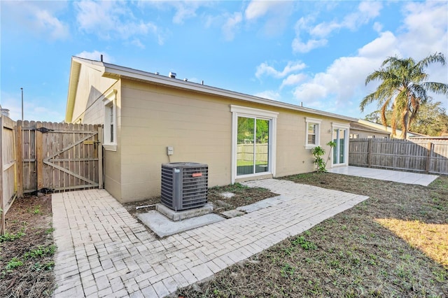 back of house featuring a patio and central AC unit