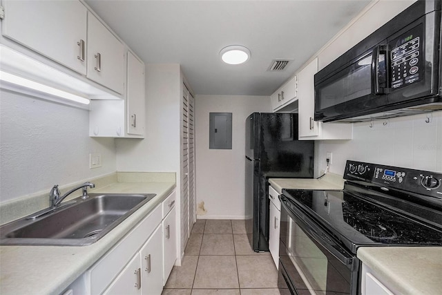 kitchen featuring white cabinetry, sink, electric panel, light tile patterned flooring, and black appliances