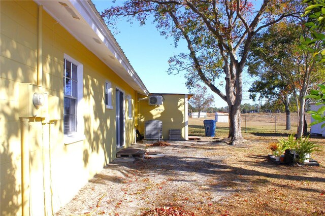 12663 Eddington Rd, Spring Hill, FL 34609 - view of yard featuring central AC unit