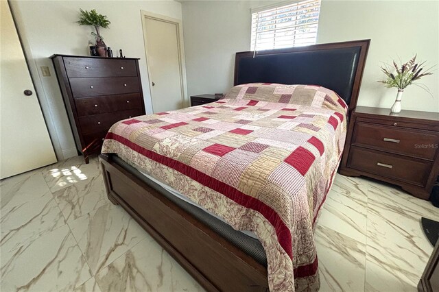 12663 Eddington Rd, Spring Hill, FL 34609 - bedroom featuring light marble finish floors