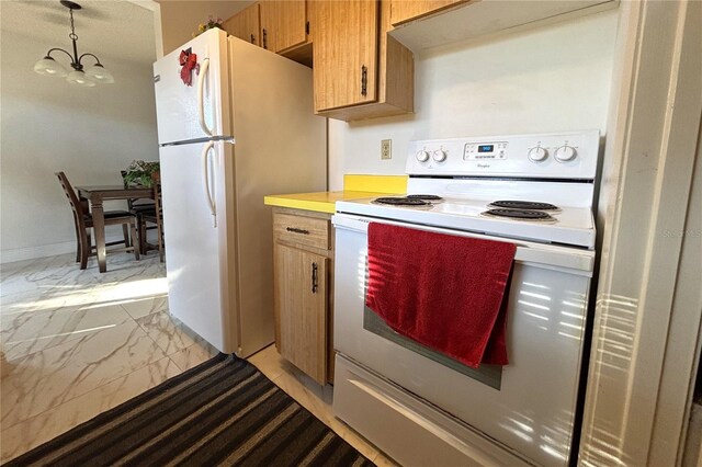 12663 Eddington Rd, Spring Hill, FL 34609 - kitchen with white appliances, light marble finish floors, light countertops, and brown cabinets