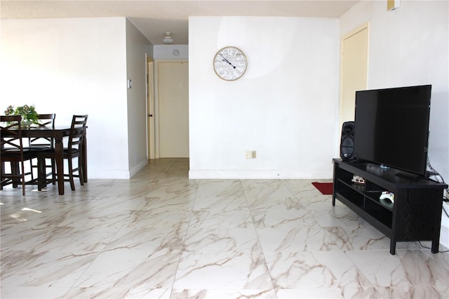 12663 Eddington Rd, Spring Hill, FL 34609 - living room featuring marble look tiles and baseboards