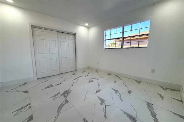 12663 Eddington Rd, Spring Hill, FL 34609 - unfurnished bedroom featuring baseboards, recessed lighting, and a closet