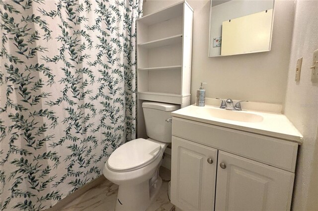 12663 Eddington Rd, Spring Hill, FL 34609 - bathroom featuring vanity, marble finish flooring, toilet, and a shower with shower curtain