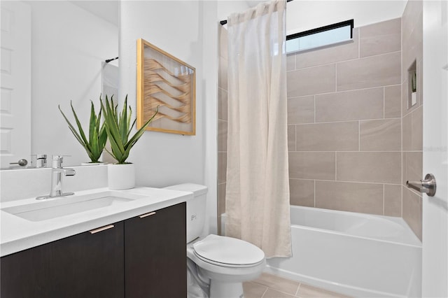 full bathroom featuring tile patterned floors, shower / bath combo with shower curtain, vanity, and toilet