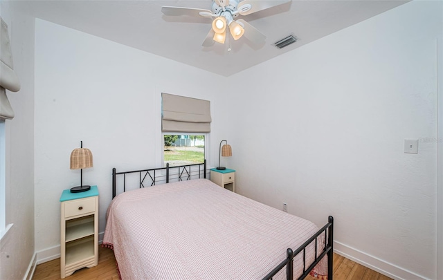 bedroom featuring light wood-type flooring and ceiling fan