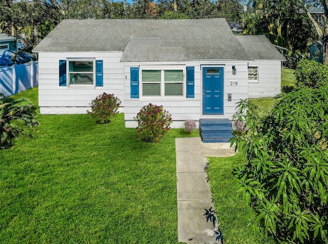 bungalow-style home featuring a front yard