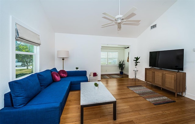 living room featuring hardwood / wood-style flooring, high vaulted ceiling, and ceiling fan