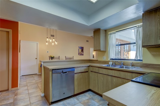 kitchen with dishwasher, sink, light tile patterned floors, decorative light fixtures, and kitchen peninsula