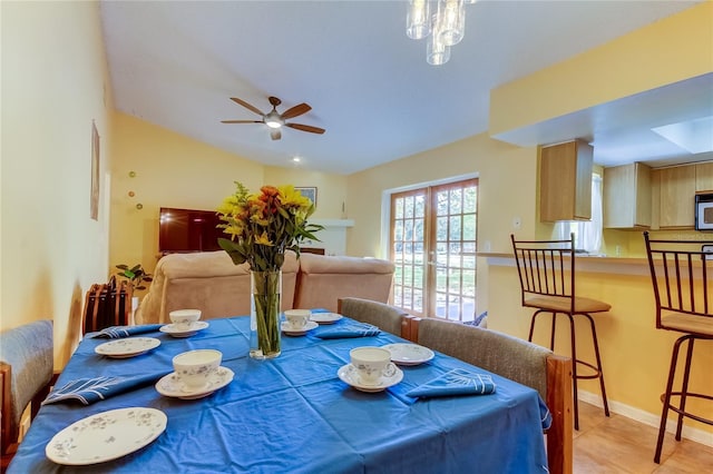 dining room with french doors, vaulted ceiling, and ceiling fan