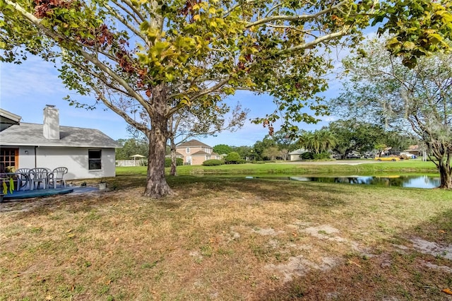 view of yard with a water view