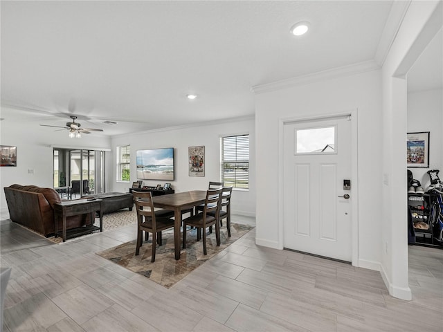 dining room featuring ceiling fan and crown molding