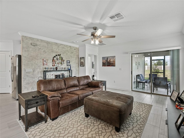 living room with ceiling fan and ornamental molding